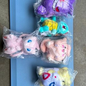 Lot of brand new (sealed) stuffed Pokémon characters with tags.